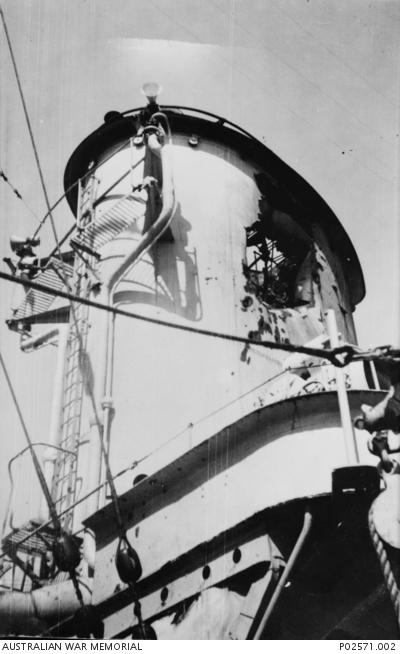 The damaged port side of HMAS Sydney&#039;s forward funnel after it was struck by a shell 