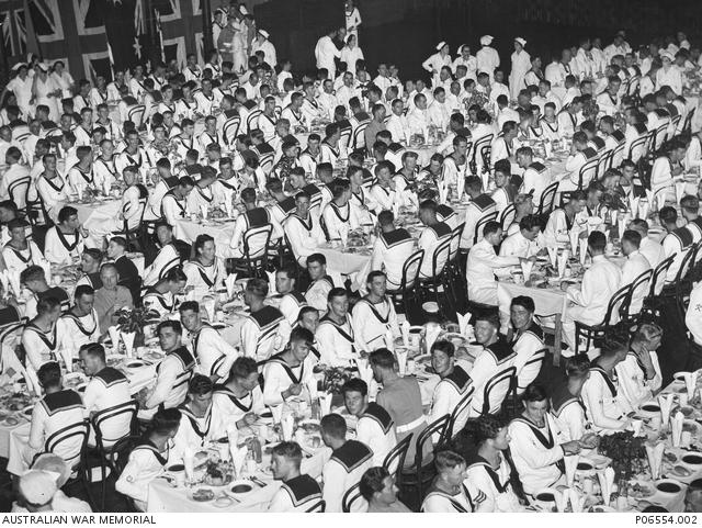 The crew of HMAS Sydney enjoy lunch at Sydney Town Hall after the ceremonial welcome home march 