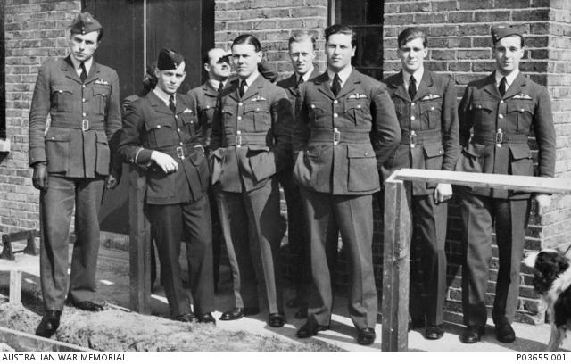 Informal group portrait of pilots from 65 Squadron, RAF.
