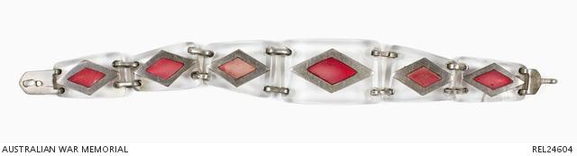 This perspex and Tek art bracelet was made by Leading Aircraftman Herbert Rouland while he was stationed in Borneo during the Second World War.