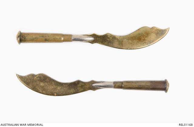 Two gold trench knives