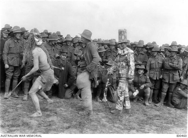 A large group of Australian soldiers gathered to watch the parade of fancy dress competitors 