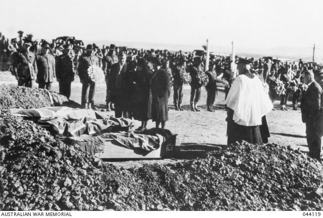 Burial of Australian soldiers killed during breakout of Japanese prisoners at camp 12B, Cowra prison of war and internment group compound, 1944-08-05.