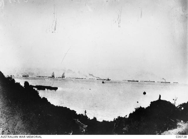 Shells bursting among the transports lying off Anzac Cove on the morning of the landing.