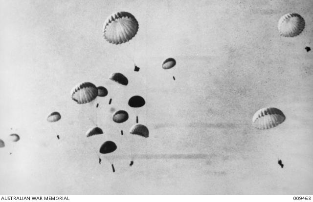 Paratroopers with their parachutes open