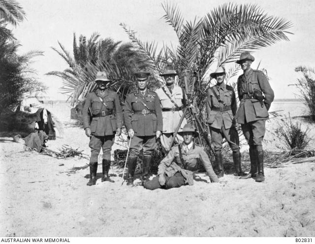 A group portrait of officers of the 3rd Australian Light Horse Brigade, at Hod Masaid. From left to right standing: Major Nicholas, General J R Royston DSO CMG, Lieutenant Colonel (Lt Col) Todd DSO, Lt Col Maygar VC, Lt Col Scott DSO; Sitting: Captain Wilfrid Kent Hughes MC.