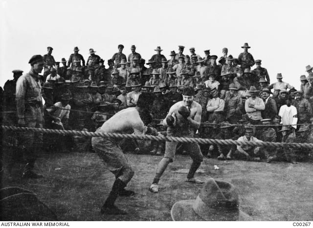 Spectators enjoy a boxing match beween two unidentified contestants during the sports carnival