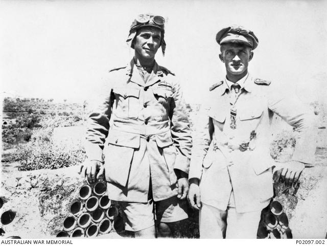 Outdoor portrait of Lieutenant (Lt) Claude Henry Vautin, No 1 Squadron, Australian Flying Corps (AFC), from Yuin, Western Australia on the left, and German aviator Oberleutnant Gerhardt Felmy on the right.