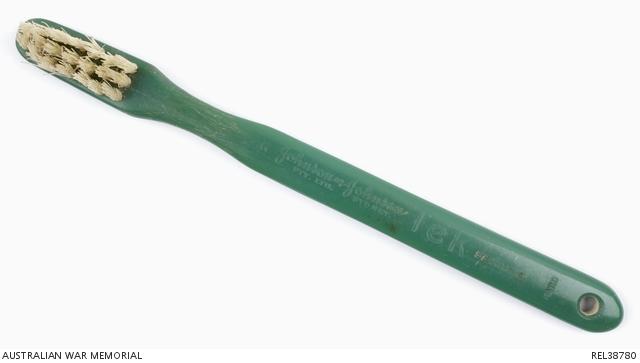A rare intact example of a Tek toothbrush issued during the Second World War.