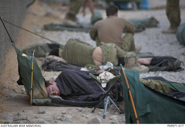Soldiers sleeping on the ground