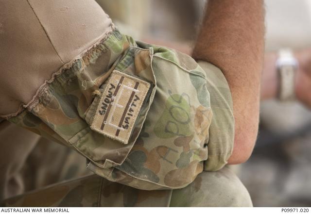 Close up of patch that says "snowy" and "smitty"