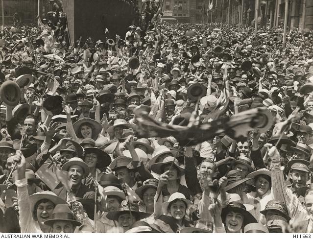 A crowd in Martin Place, central Sydney, celebrate the news of the signing of the armistice. 