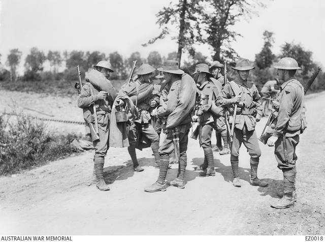 Troops of the 2nd Australian Division chatting during movement to the trenches in France, 1916.