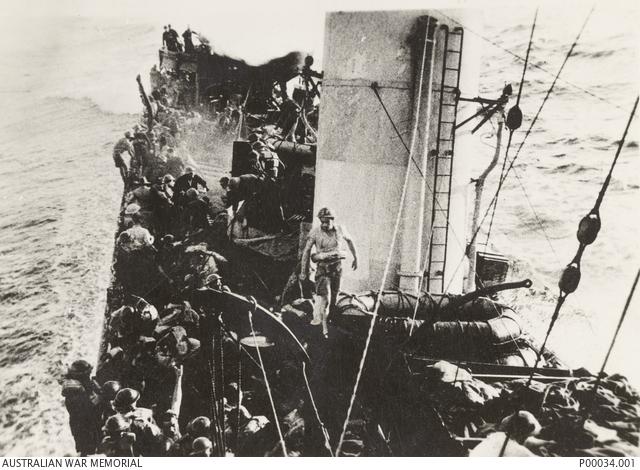 The Australian W Class Destroyer HMAS Waterhen takes water over her bow