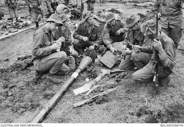 Inspecting captured enemy weapons at Binh Ba after the battle