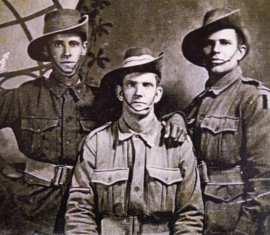 A photograph of three men, including George Hurst.
