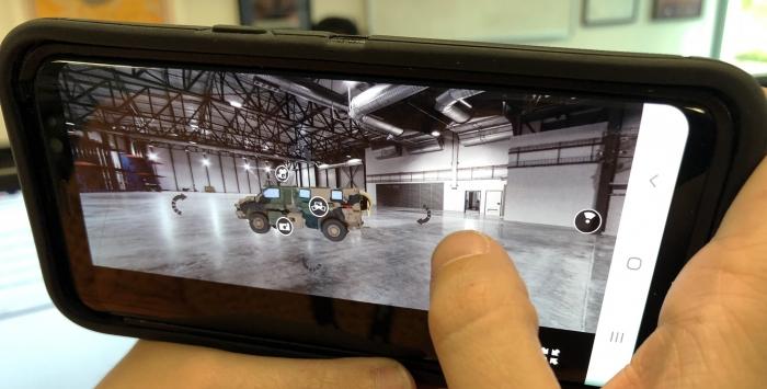 Person displaying on closer inspection on mobile phone