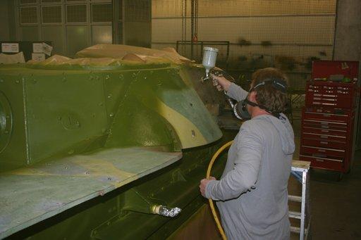 First coat of green being applied by spray painting. First coat of green being applied by spray painting.