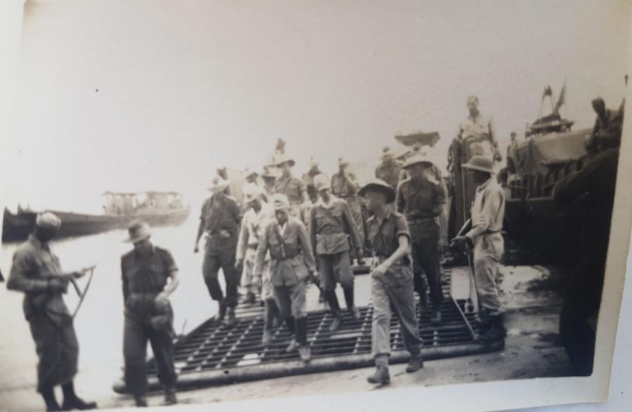 The Japanese being escorted by Australian troops.