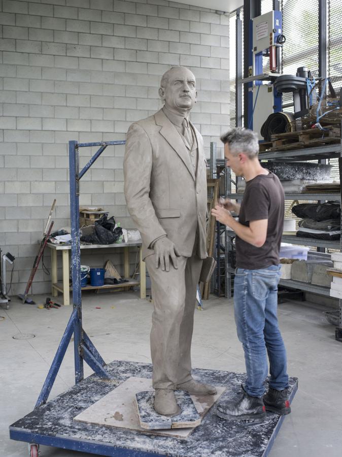 Sculptor Charles Robb at work.