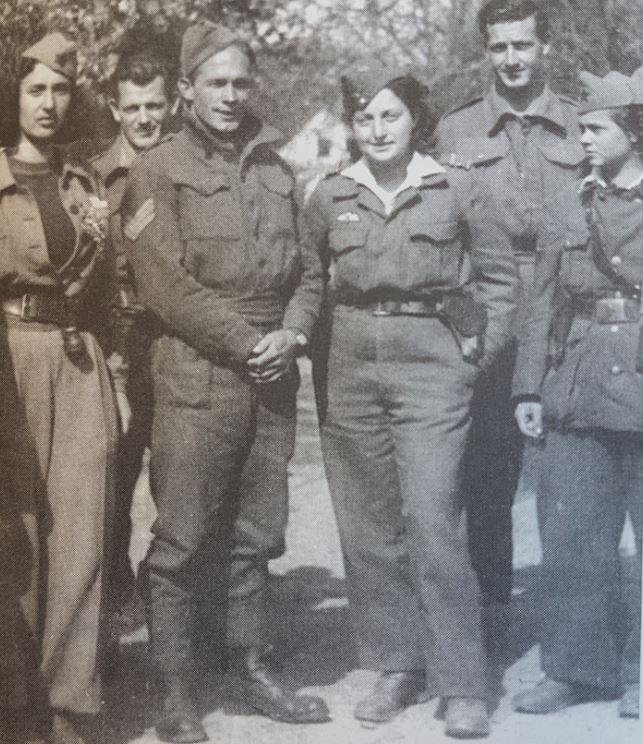 Ernest Brough, pictured second from right, with a group of Partisans and a British liaison officer. Allan Berry is pictured third from left and Eric Batty is behind him. Photo: Courtesy Ernest Brough