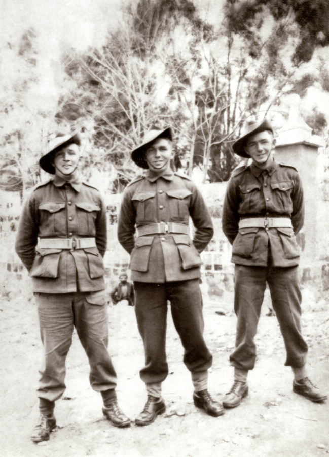 Sydney Shaw, centre, with his brothers Bob and Roy, all of the 2/32nd battalion.