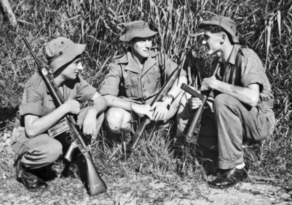 Private Ian Lloyd in conversation with his commander, Lt Harry Smith (centre), and another company member, Lance Corporal Sam Farmer. (HOB/56/0826/MC)