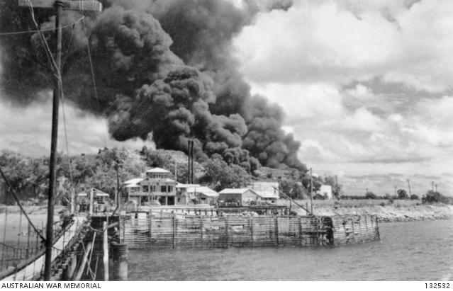  AWM132532 Oil tanks on Stokes Hill burn during the first Japanese air raid.