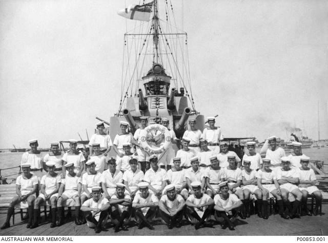 Group portrait of some of the crew members aboard HMAS Sydney II possibly following their successful action against the Italian cruiser Bartolomeo Colleoni off Cape Spada, Crete, on 19 July 1940