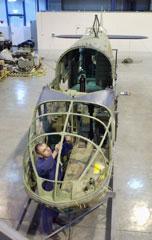 Sheet metal worker Stuart Attenborough fitting the navigator's cupola frame to the cockpit section