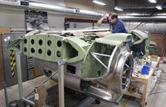 Sheet metal worker Lee Davies fitting out the leading edge of the centre wing section